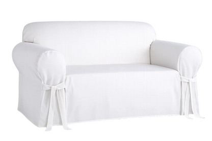 White loveseat covered with a fitted slipcover on a white background